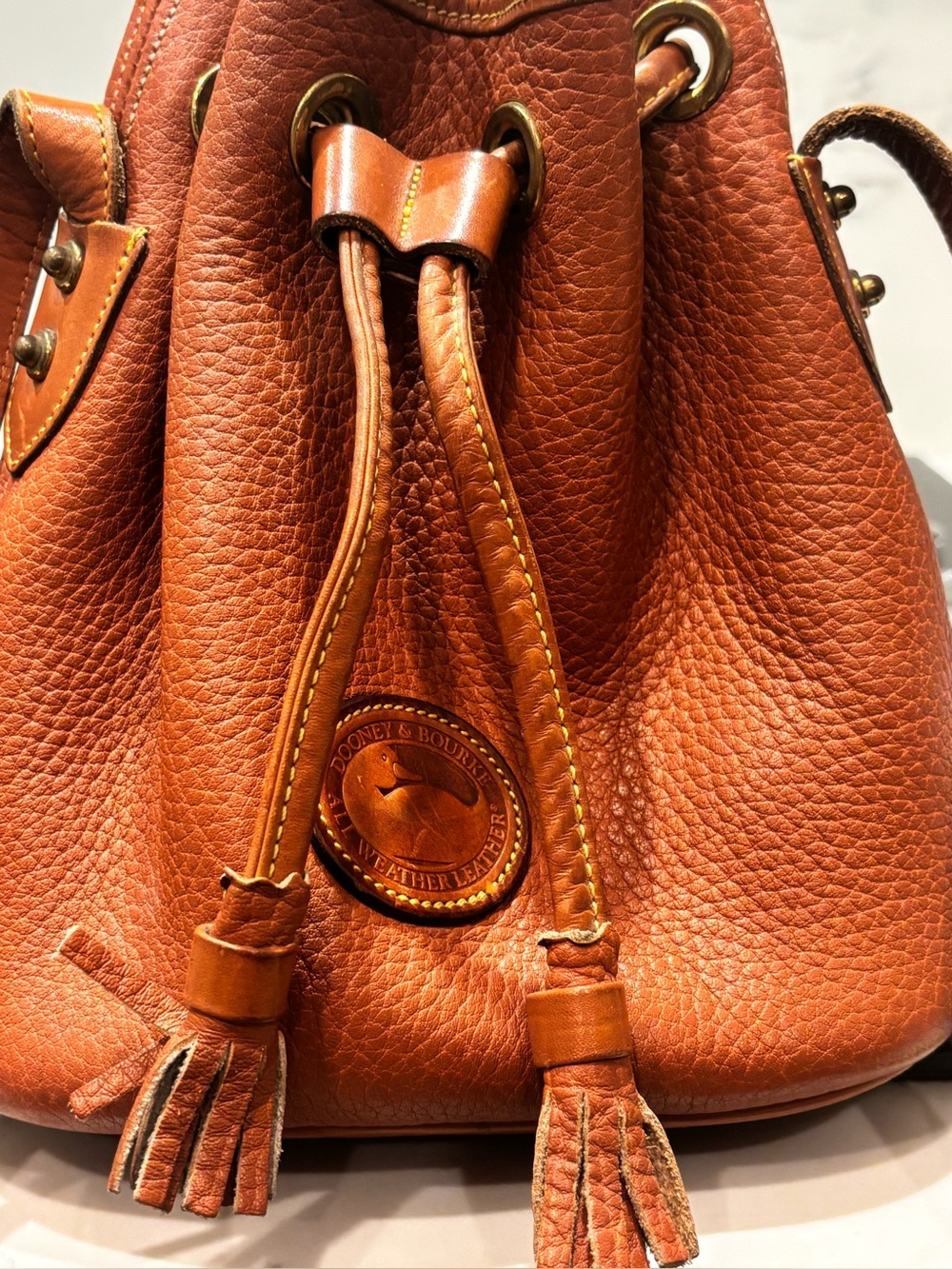 Dooney & Bourke Brown Pebble Leather Drawstring, adjustable strap, GENTLY used.